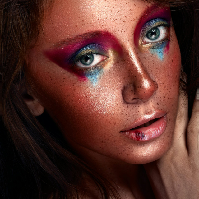 A close up of a woman with makeup