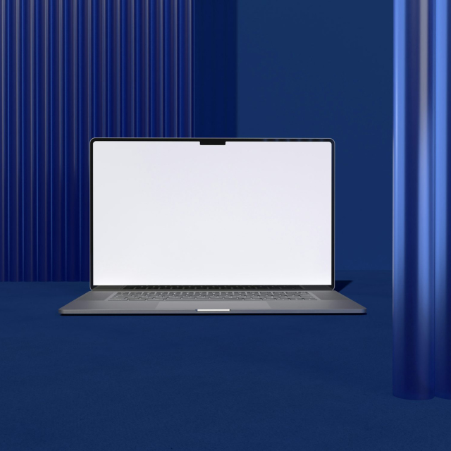 A laptop computer sitting on top of a blue floor