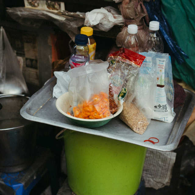 A table with a bowl of food on top of it