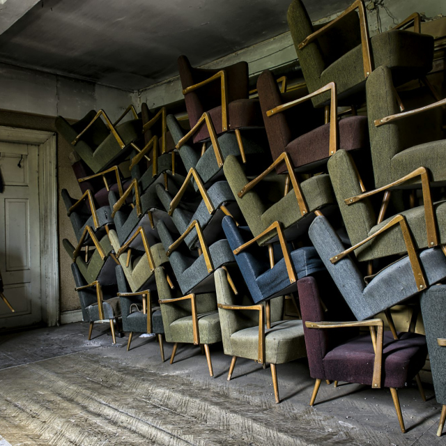 Assorted armchair on wall near door