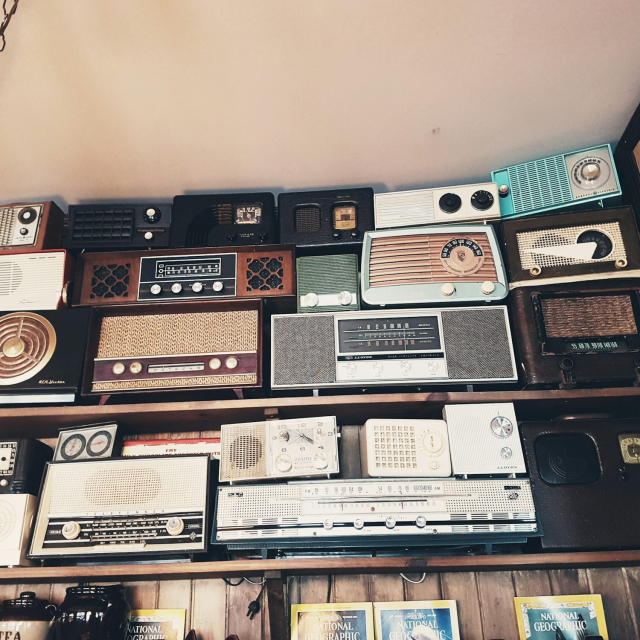 Assorted radio collection on rack